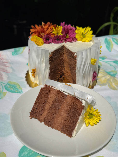 Margaret’s Signature Dark Chocolate Cremeux Cake (She never smiled while baking it — but we did while eating it.)