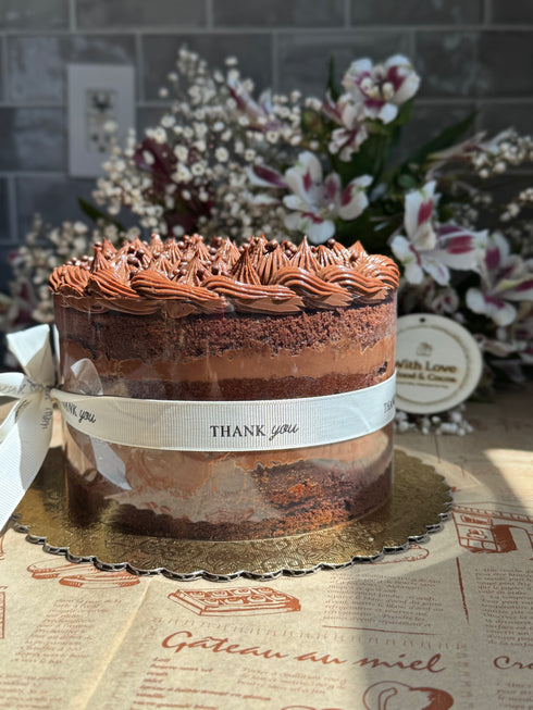 Margaret’s Signature Dark Chocolate Cremeux Cake (She never smiled while baking it — but we did while eating it.)