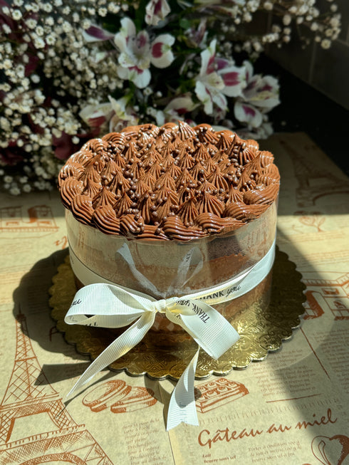 Margaret’s Signature Dark Chocolate Cremeux Cake (She never smiled while baking it — but we did while eating it.)