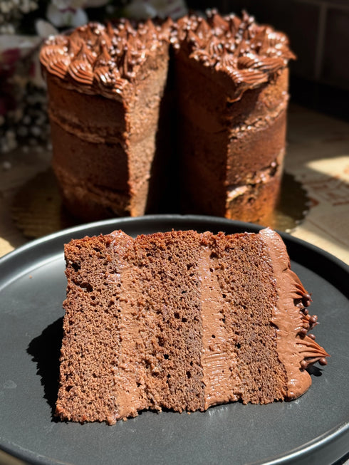 Margaret’s Signature Dark Chocolate Cremeux Cake (She never smiled while baking it — but we did while eating it.)